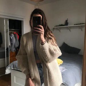 Knitted cardigan with knotted wrap closure sand